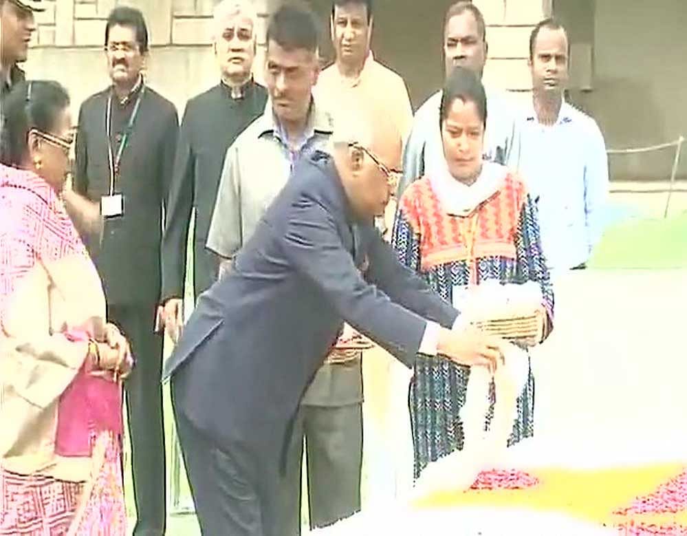 After offering floral tributes at the Mahatma's memorial, the 71-year-old leader returned to his 10, Akbar Road residence. Image courtesy: ANI