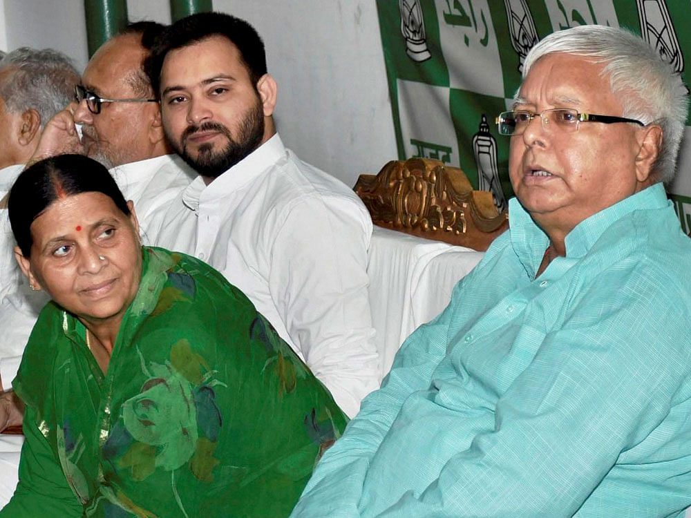 RJD Chief Lalu Prasad Yadav with wife Rabri Devi, Bihar Deputy Chief Minister Tejaswi Yadav. AP, PTI Photo