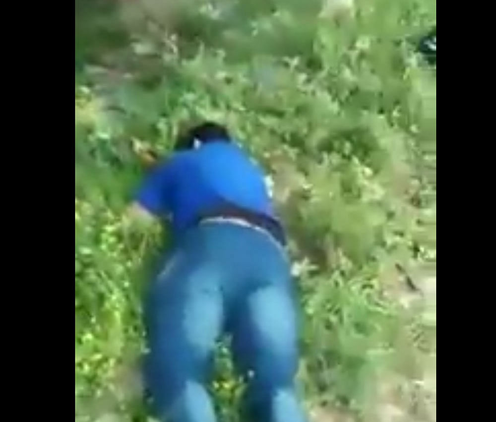 Screenshot of video uploaded on Twitter showed the corpse of the policeman lying in the bushes.