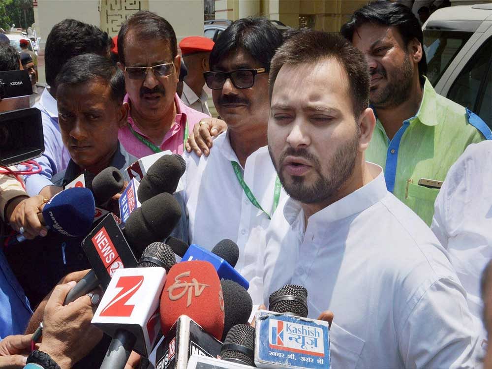 Bihar Deputy Chief Minister Tejashwi Yadav interacts with media after casting his vote for Presidential election 2017, at Bihar Vidhan Sabha in Patna on Monday. PTI Photo