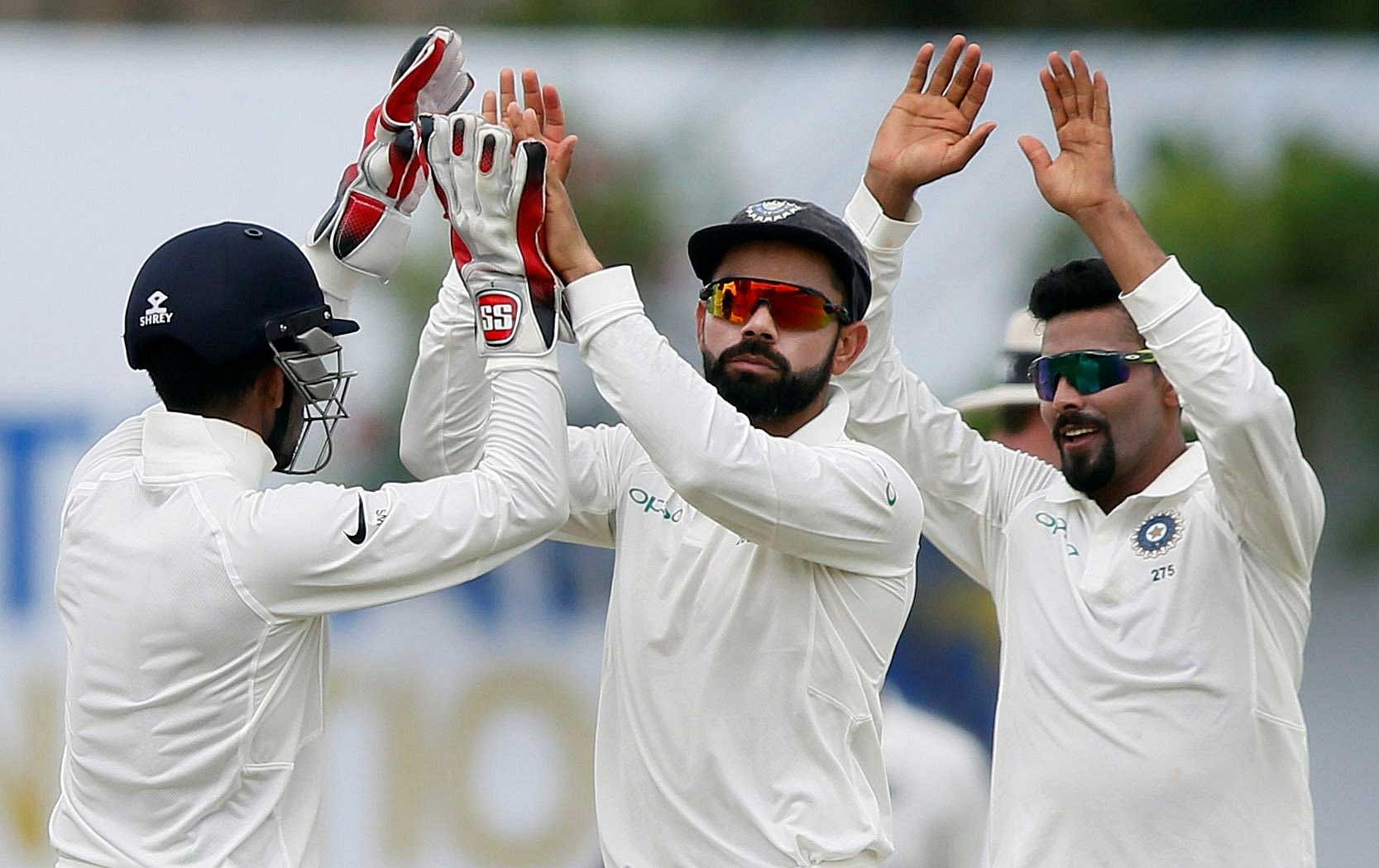 India's captain Virat Kohli and his teammates celebrate. REUTERS