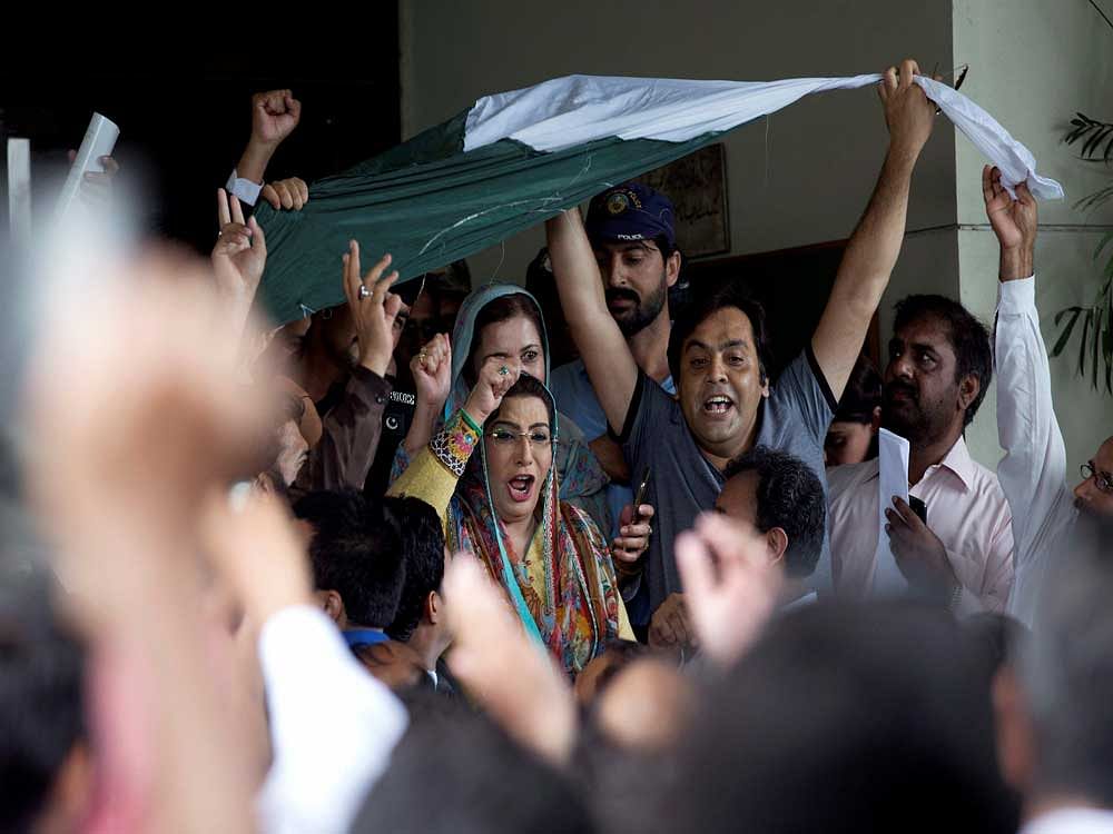 Supporters of the opposition parties celebrate the dismissal of Pakistani Prime Minister Nawaz Sharif at the Supreme Court in Islamabad, Pakistan, Friday, July 28, 2017. Pakistan's Supreme Court in a unanimous decision has asked the country's anti-corruption body to file corruption charges against Sharif, his two sons and daughter for concealing their assets. AP/PTI Photo