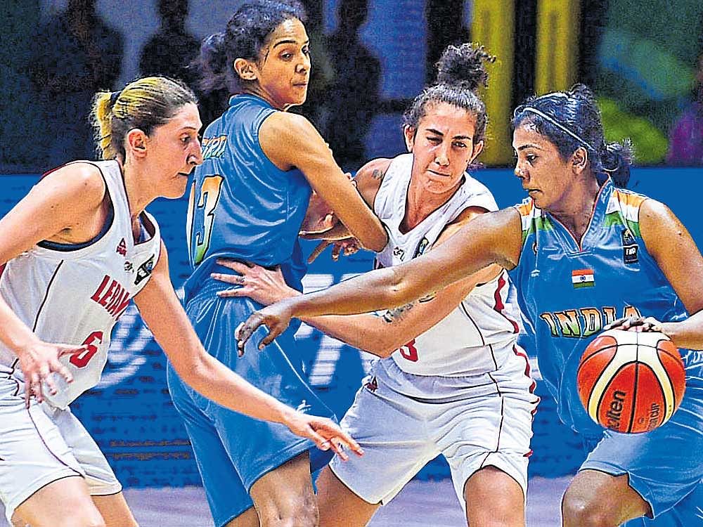 resilient: Captain Anitha Pauldurai (right) and Jeena Skaria (second from left) were instrumental in India's triumph at the FIBA Women's Asia Cup. DH Photo/ Krishna Kumar PS