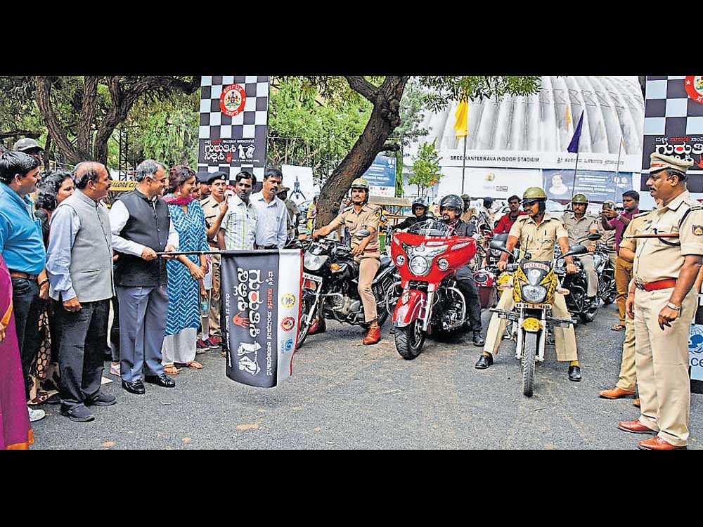 Director General and Inspector General of Police Rupak  Kumar Dutta flags off a bike rally in Bengaluru on Sunday  to create awareness on human trafficking. Karnataka State Commission for Protection of Child Rights chairperson Kripa Amar Alva is seen. DH PHOTO