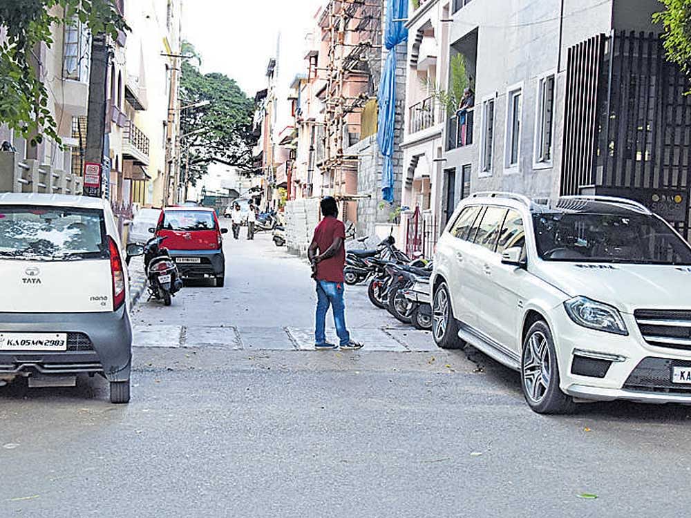 Parked vehicles take up to 20% space on city's roads. Picture shows cars parked in Jayanagar 2nd Block. dh photo