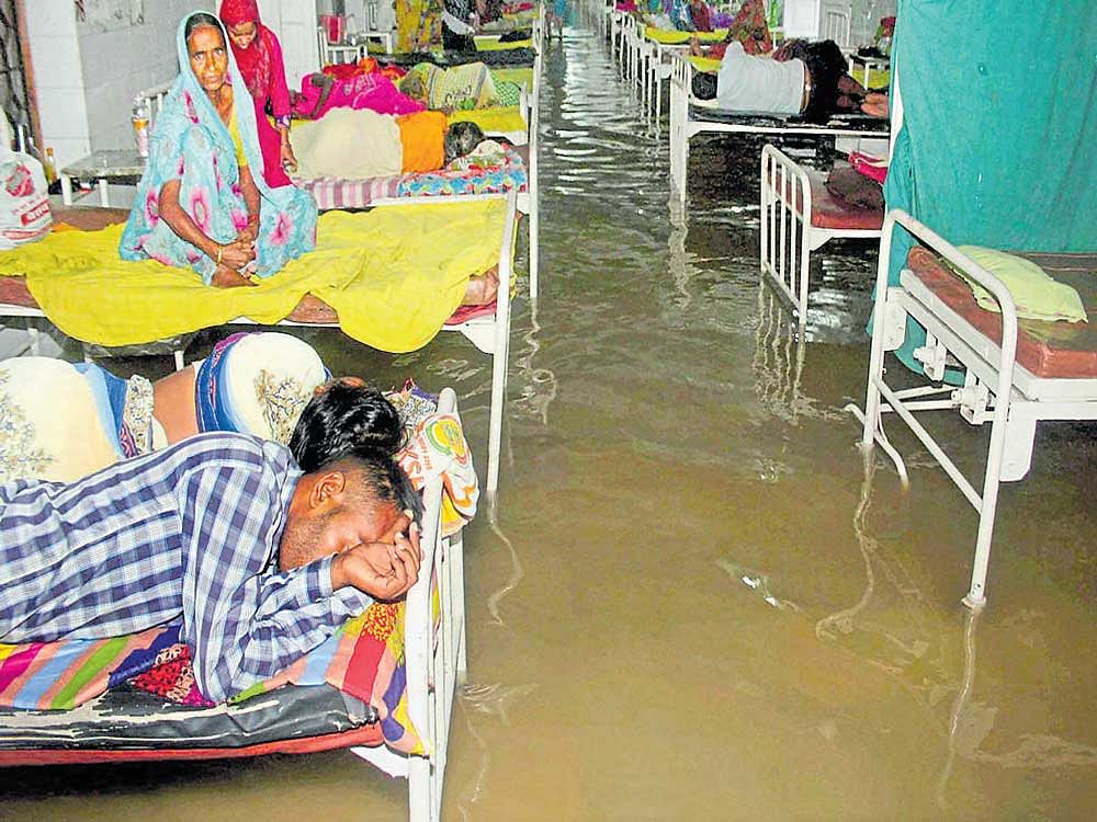 Disease and deluge: A waterlogged Nalanda Medical College and Hospital after heavy rain in Patna on Friday. PTI