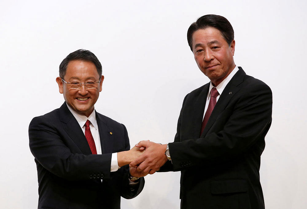 Toyota Motor President Akio Toyoda and Mazda Motor President Masamichi Kogai attend a joint news conference in Tokyo, Japan. Reuters/Kim Kyung-Hoon/File Photo.