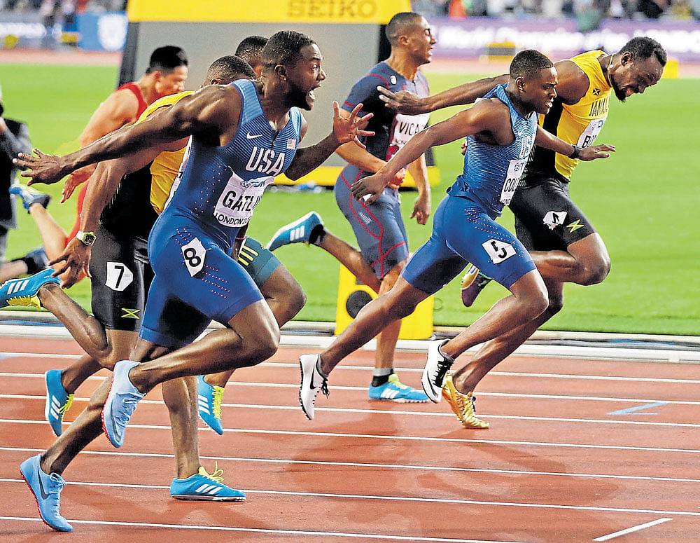 touch and go: Justin Gatlin (left) wins the 100M ahead of fellow American Christian Coleman (second from right) and Jamaica's Usain Bolt (right). AFP