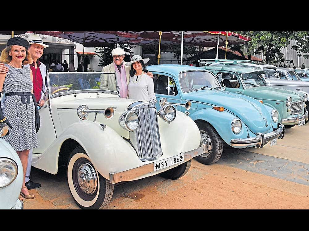 ageless: Enthusiasts pose for pictures at The Whitefield Vintage Car Rally on Sunday. dh Photo