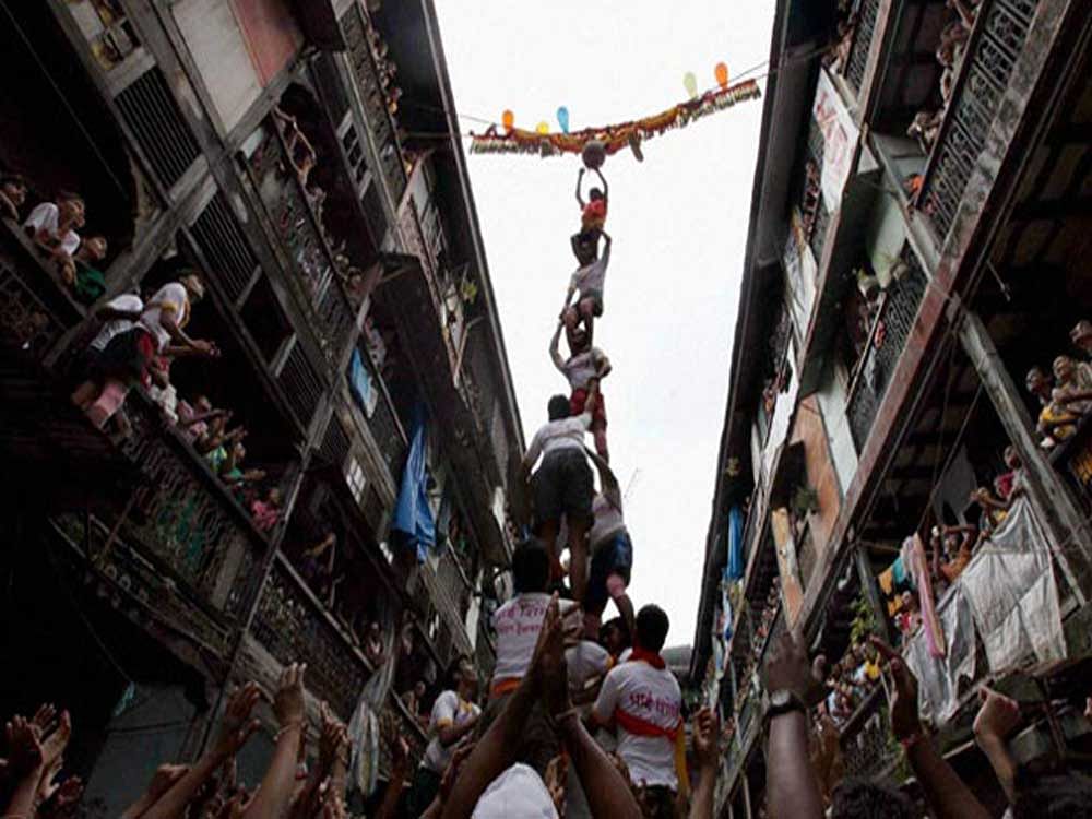 During the festival, Govindas, as the participants or revellers are known,  re-enact the myth of Lord Krishna stealing butter from a hanging pot, known as the Dahi-handi. PTI file photo