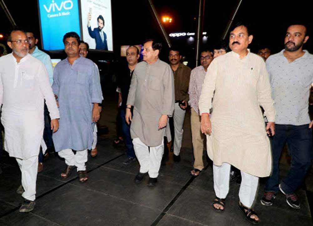 Senior Congress leaders Bharatsinh Solanki, Arjun Modhwadia, Ahmed Patel at Ahmedabad airport during arrival of the party's MLAs from Karnataka on Monday, ahead of Rajya Sabha elections. PTI
