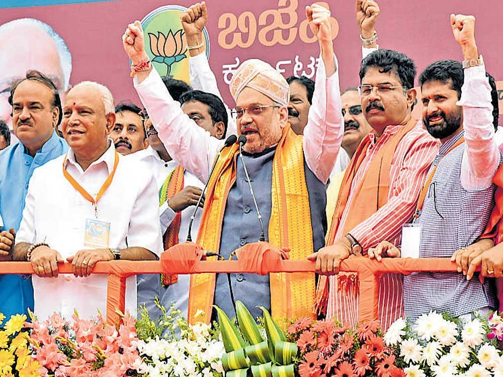 BJP national president Amit Shah at a public meeting on in Bengaluru on Saturday. DH Photo