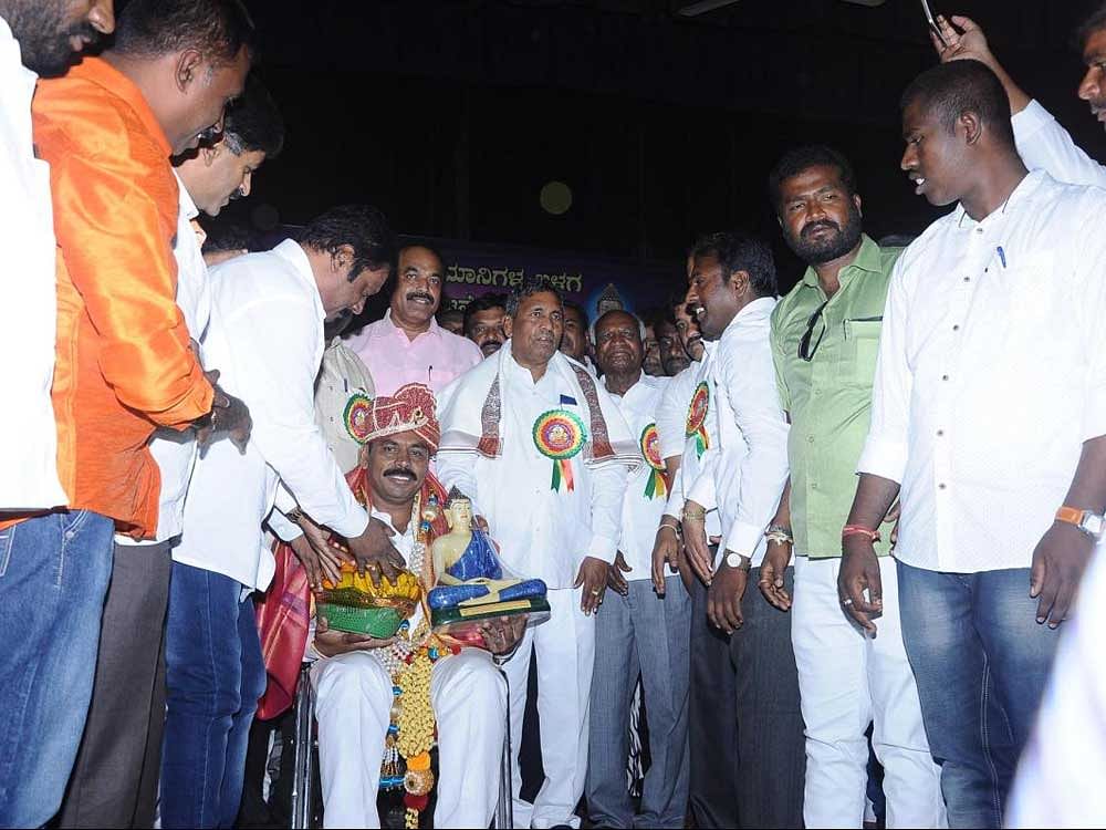 Jayadev, the newly elected president of the district Congress unit being felicitated at a programme at T Chennaiah Ranga Mandira in Kolar on Sunday. dh photo