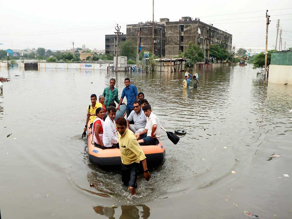 The unrelenting flow of water from upstream regions coupled with monsoon rains has flooded as many as 20 districts with the flooding spreading to other parts, officials said. PTI file image for representation.