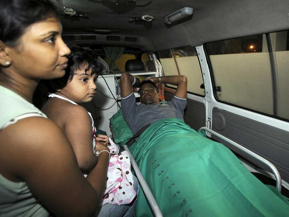 A 2009 photo of Thilan Samaraweera being taken in an ambulance after arriving in Colombo. Samaraweera is seen with his wife Manjula and daughter. The cricketer was hit by a bullet when terrorists opened fire on the Lankan team bus in Lahore.