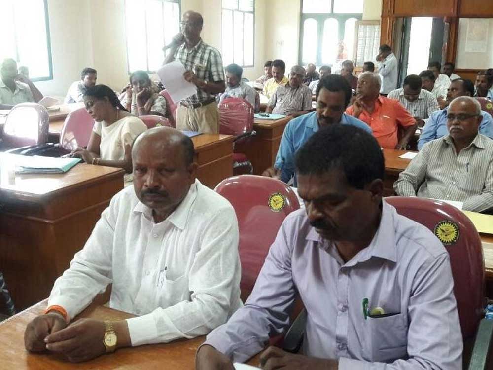 Officials from various departments attend the public grievance redress meeting in Kolar on Wednesday. DH photo