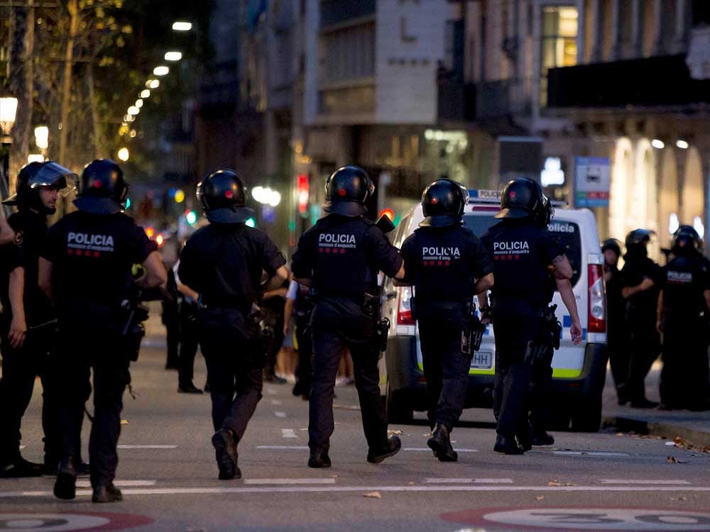 Police patrol the area after a van crashed into pedestrians near the Las Ramblas avenue in central Barcelona, Spain August 17, 2017. REUTERS