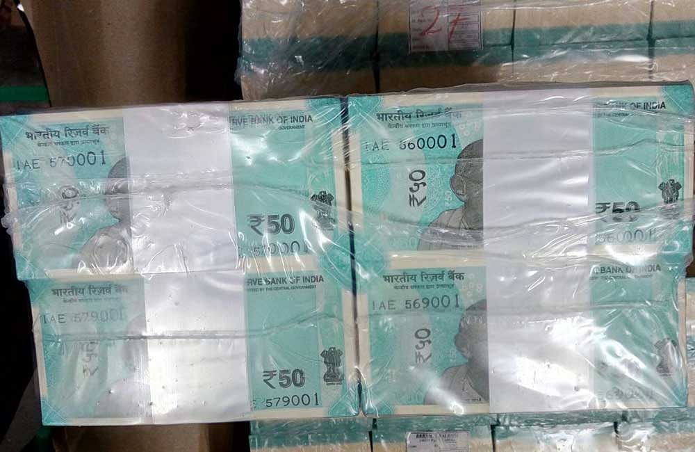 A few bundles of the new Mahatma Gandhi series Rs. 50 notes ready for circulation. Photo credit: Reddit.