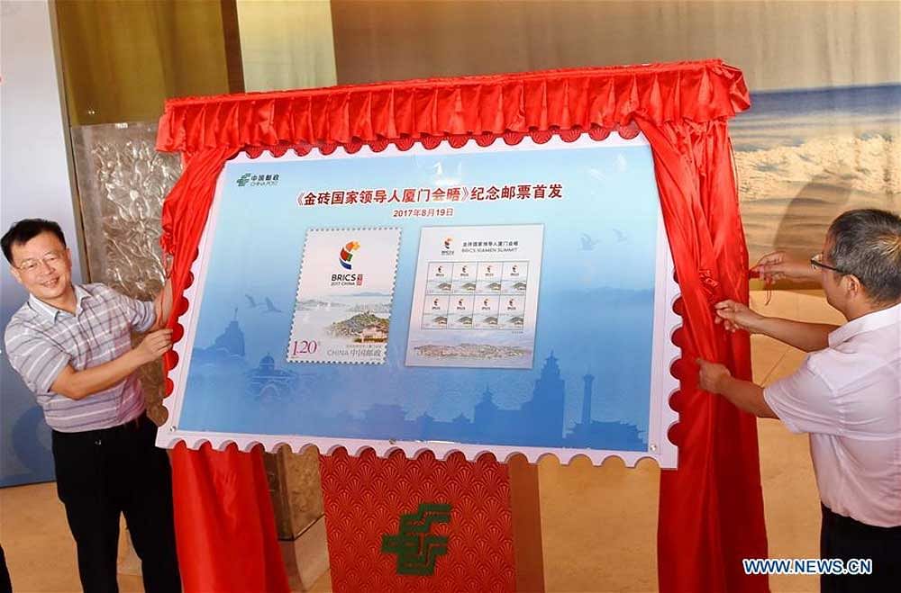 The postal stamp being unveiled in Xiamen ahead of the upcoming BRICS summit. Photo credit: news.cn.