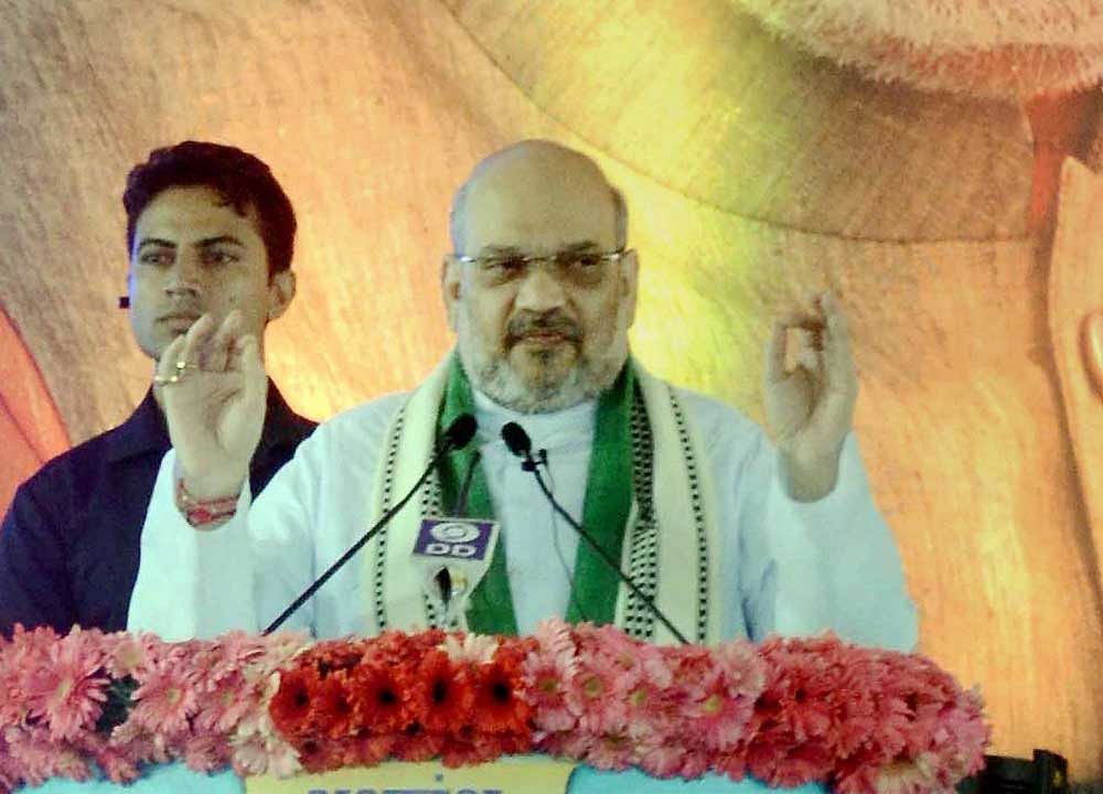 Amit Shah extolled the various programmes started by Narendra Modi for development, adding that the previous government had caused the economy to paralyse. PTI photo.