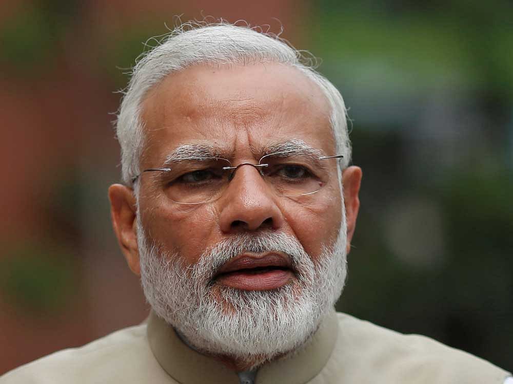 Modi was informed of the number of farmers benefited through the crop insurance scheme last year and the Rabi season, with over Rs. 7,700 crores disbursed to the insurance-takers under the scheme. reuters file photo.