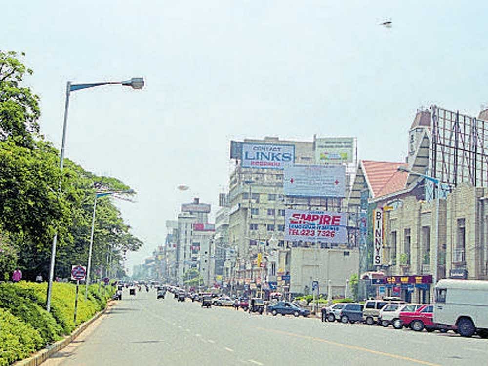 A photograph by K Venkatesh shows the boulevard on MG Road before the construction of Metro