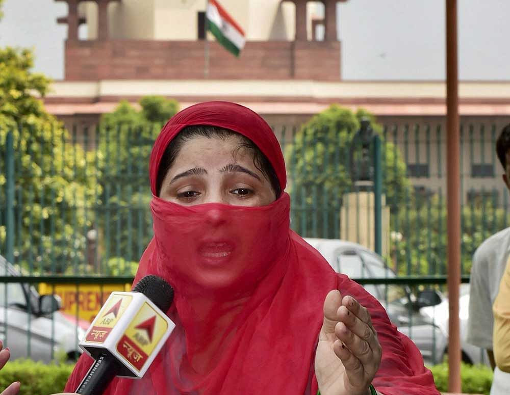 Zeenat Ali Siddiqui, who claims to be a victim of Triple talaq, speaks with media after verdict on it, outside the Supreme Court in New Delhi on Tuesday. PTI Photo