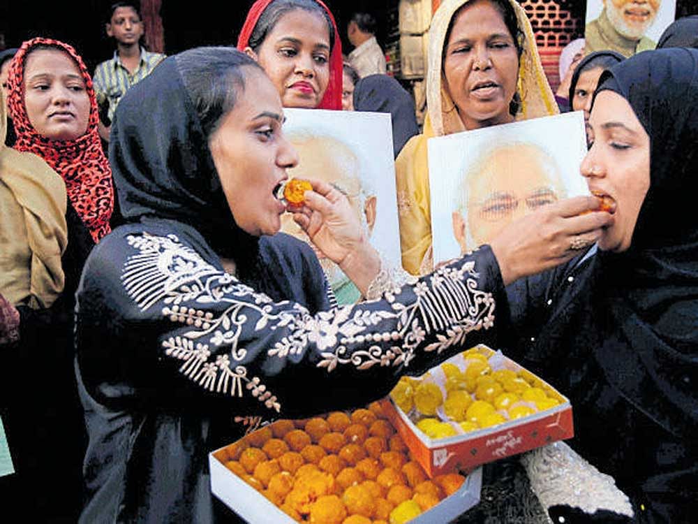Muslim women celebrate the Supreme Court's decision on triple talaq in Mumbai on Tuesday. PTI