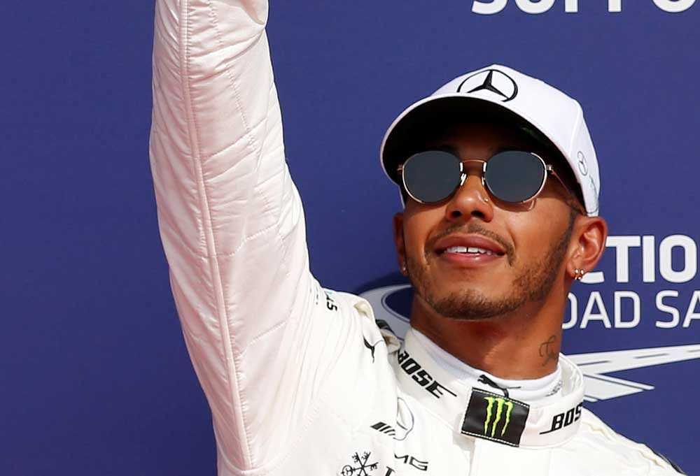 Mercedes' Lewis Hamilton celebrates his pole position after qualifying session for the Belgian Grand Prix. Reuters photo.