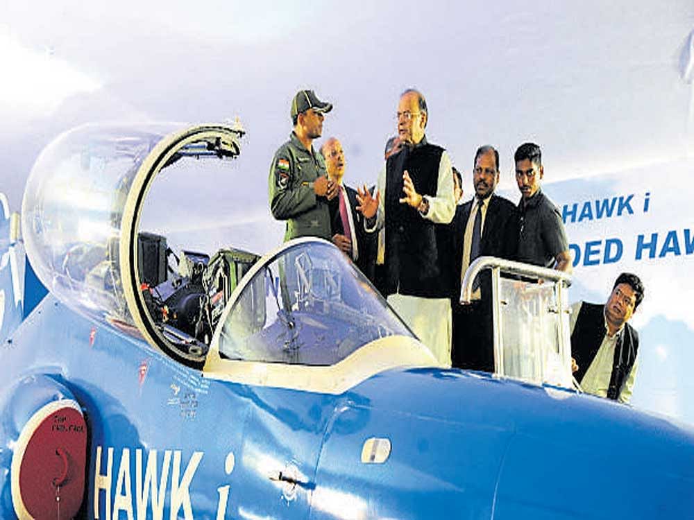 Defence Minister Arun Jaitley with a pilot after dedicating the Hawk-i Intermediate Jet Trainer at HAL on Saturday.