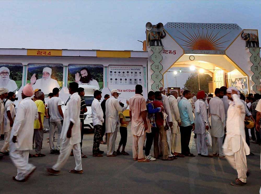 Located in and around Dera premises, these shops have the word 'Sach' (truth) prefixed to their respective names and give out plastic 'coins' or tokens of Rs 10 and Rs 5 to customers if they are unable to tender change in Indian currency. In picture: Dera Sacha Sauda Ashram. Photo credit: PTI. Representational Image.