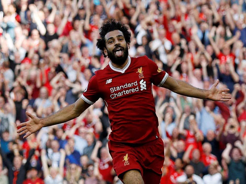ECSTATIC Liverpool's Mohamed Salah celebrates after scoring against Arsenal. REUTERS