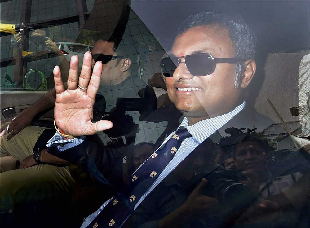 Karti Chidambaram, son of former Union minister P Chidambaram, waves as he arrives at the CBI headquarter in New Delhi in connection with INX Media case. PTI file photo.