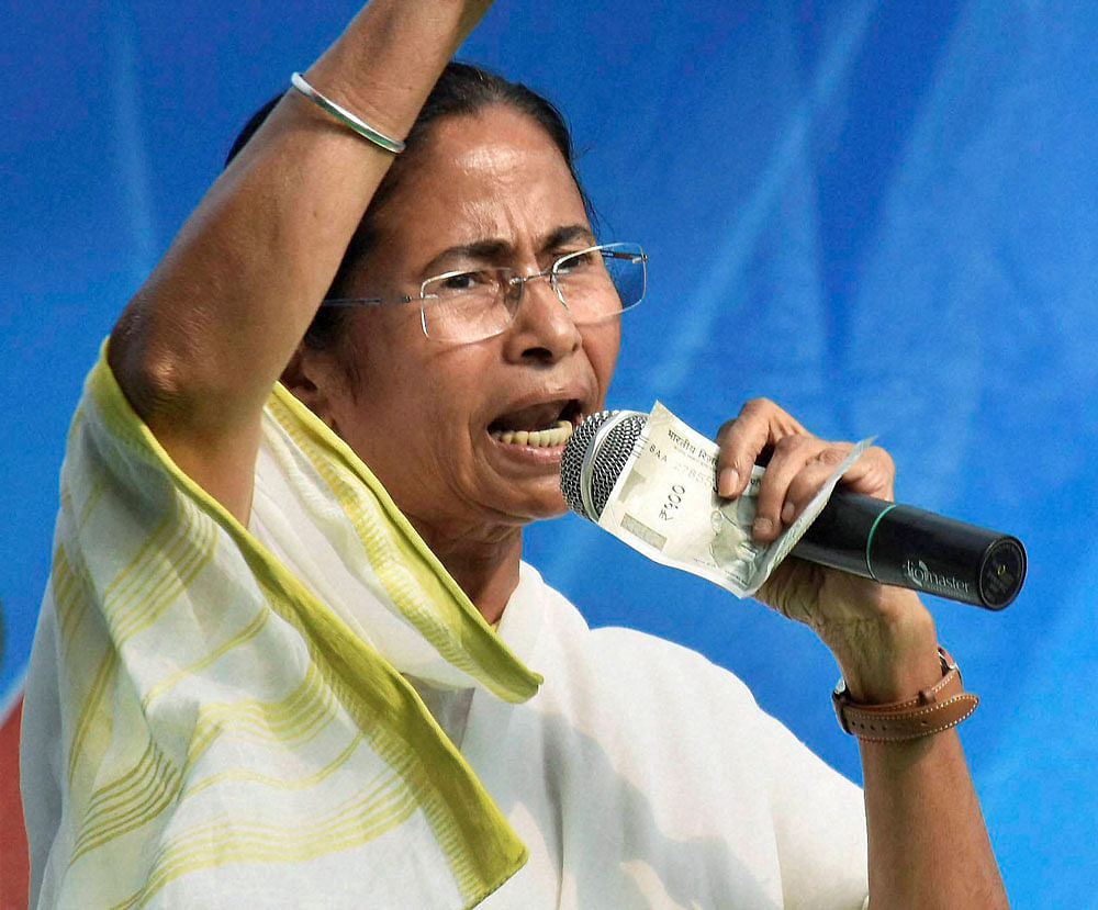 Proclaiming that her party would never allow BJP's communal politics, Mamata Banerjee made a clarion call to get the party ousted from the Lok Sabha in the upcoming polls. PTI file photo.