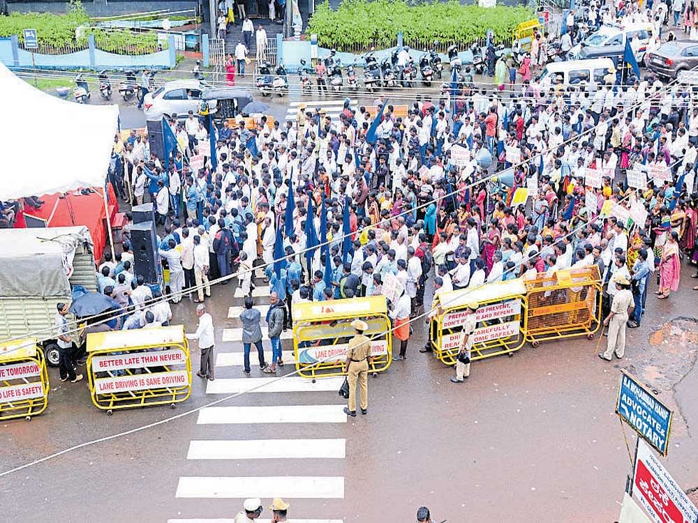 Dalits take out a protest rally in Mangaluru on Monday and urged the government to allot DC Manna lands to dalits.