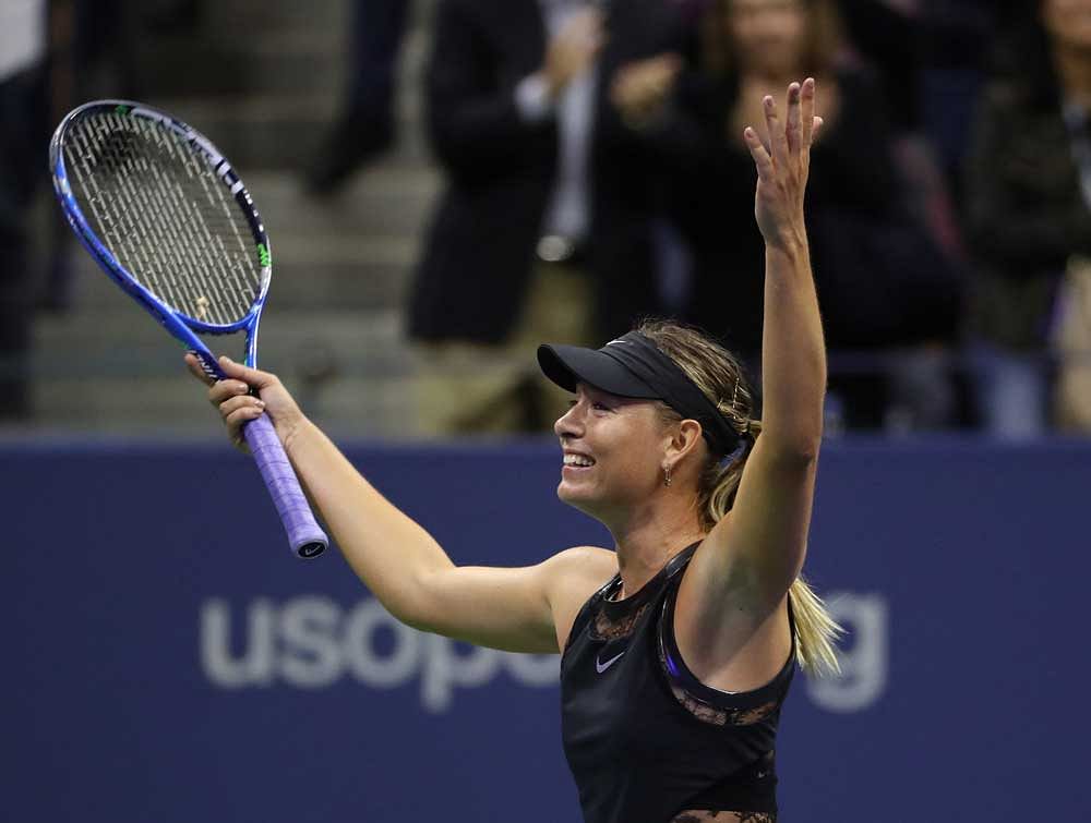 Maria Sharapova of Russia waves to the crowd after her match against Simona Halep of Romania on day one of the US Open tennis tournament at USTA Billie Jean King National Tennis Center. Credit: Geoff Burke-USA TODAY Sports/Reuters