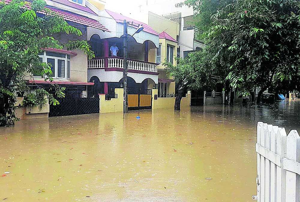 Heavy rain that lashed the city left Koramangala 4th block inundated. DH Photo