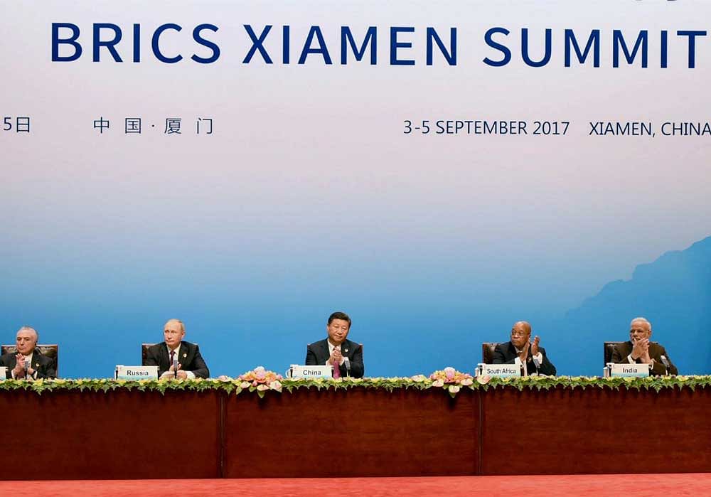 Chinese President Xi Jinping (C) delivers his speech while flanked by Brazilian President Michel Temer (L), Russian President Vladimir Putin (2nd L), South Africa's President Jacob Zuma (2nd R), and Indian Prime Minister Narendra Modi (R) during the BRICS Business Council signing ceremony at the BRICS Summit in Xiamen, China on Monday. PTI Photo