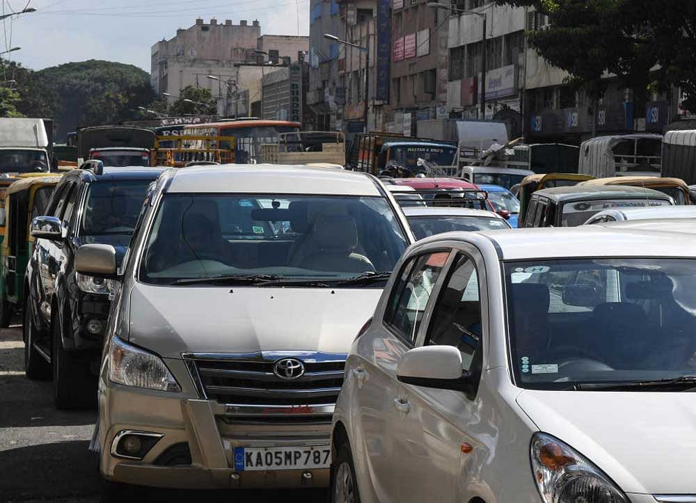Traffic held up on JC Road during Chief Minister Siddaramaiah's city rounds on Wednesday.