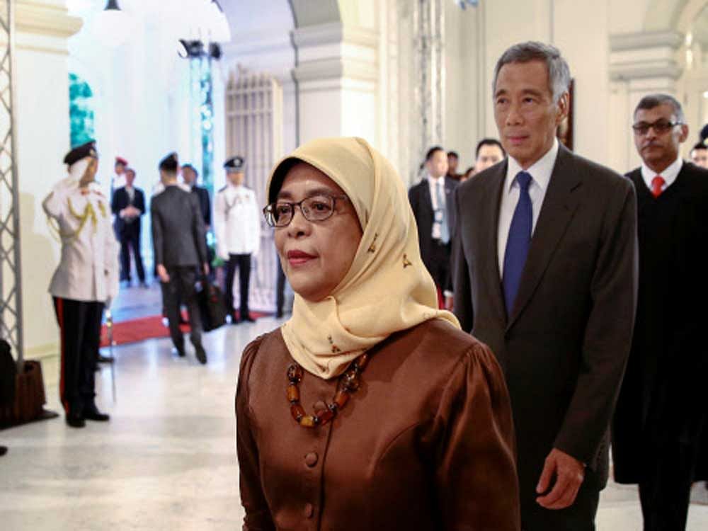 President-elect Halimah Yacob (L-R) , Singapore Prime Minister Lee Hsien Loong and Chief Justice Sundaresh Menon enter the state room before the presidential inauguration ceremony at the Istana Presidential Palace in Singapore. Reuters Photo