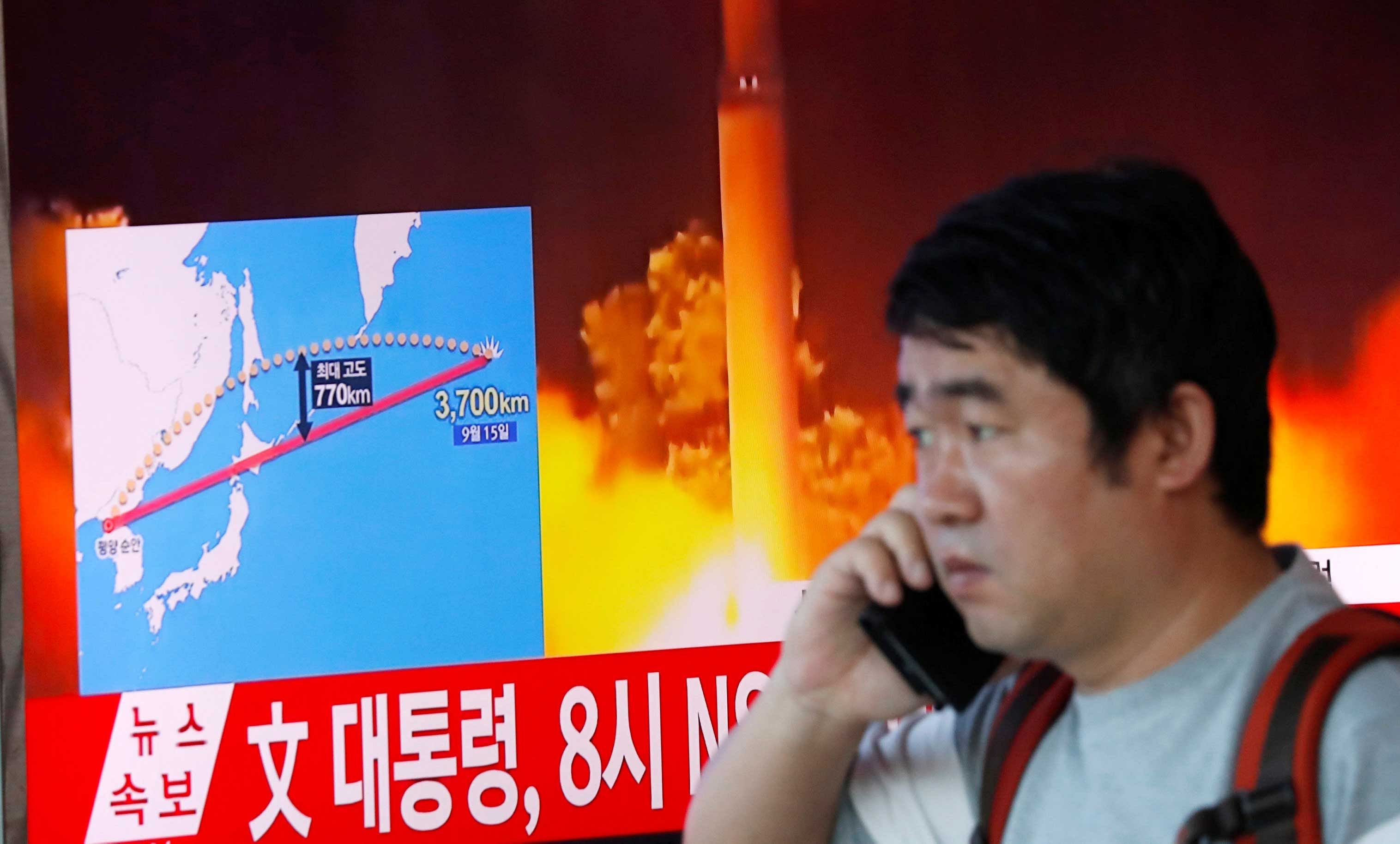 A man watches a television broadcasting a news report on North Korea firing a missile that flew over Japan's northern Hokkaido far out into the Pacific Ocean, in Seoul. Reuters photo