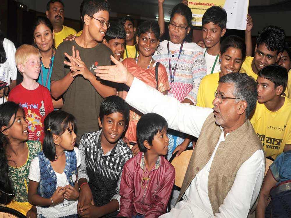 Nobel peace laureate Kailash Satyarthi interacts with students at a programme in Bengaluru on Saturday. Photo Srikanta Sharma R
