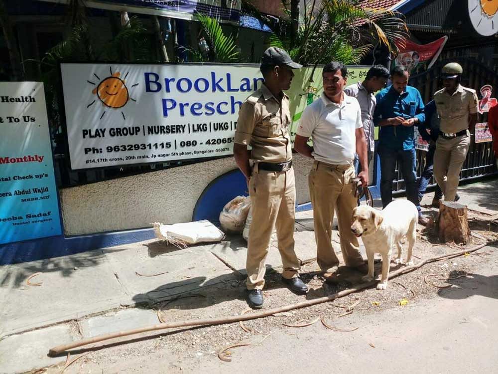 The dog squad personnel carry out a search near a playschool in JP Nagar after a few residents and the school staff called police helpline and informed them about a suspicious object found near the school.