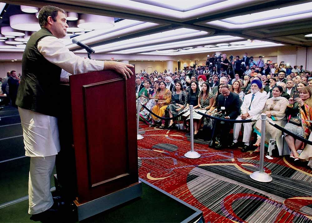Rahul Gandhi addressing during a meeting with NRIs at Times Square in New York City. PTI photo.