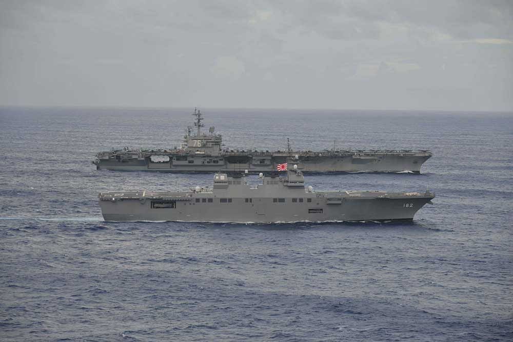 USS Ronald Reagan sails with Japan Maritime Self-Defense Force destroyer Ise during their joint military drill in the sea off Japan. Reuters photo.