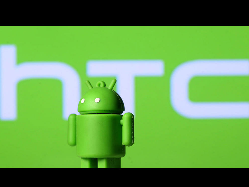 A 3D printed Android mascot Bugdroid is seen in front of an HTC logo. Reuters Image