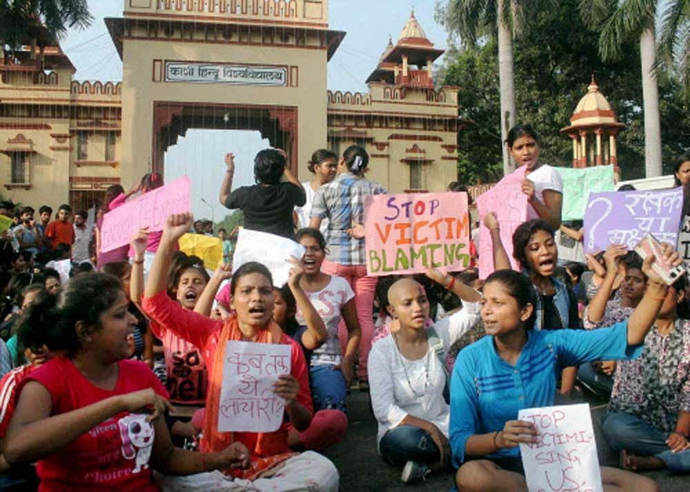 Students of the Banaras Hindu University protest for the third day against the molestation of a student inside the campus, in Varanasi on Saturday. PTI Photo