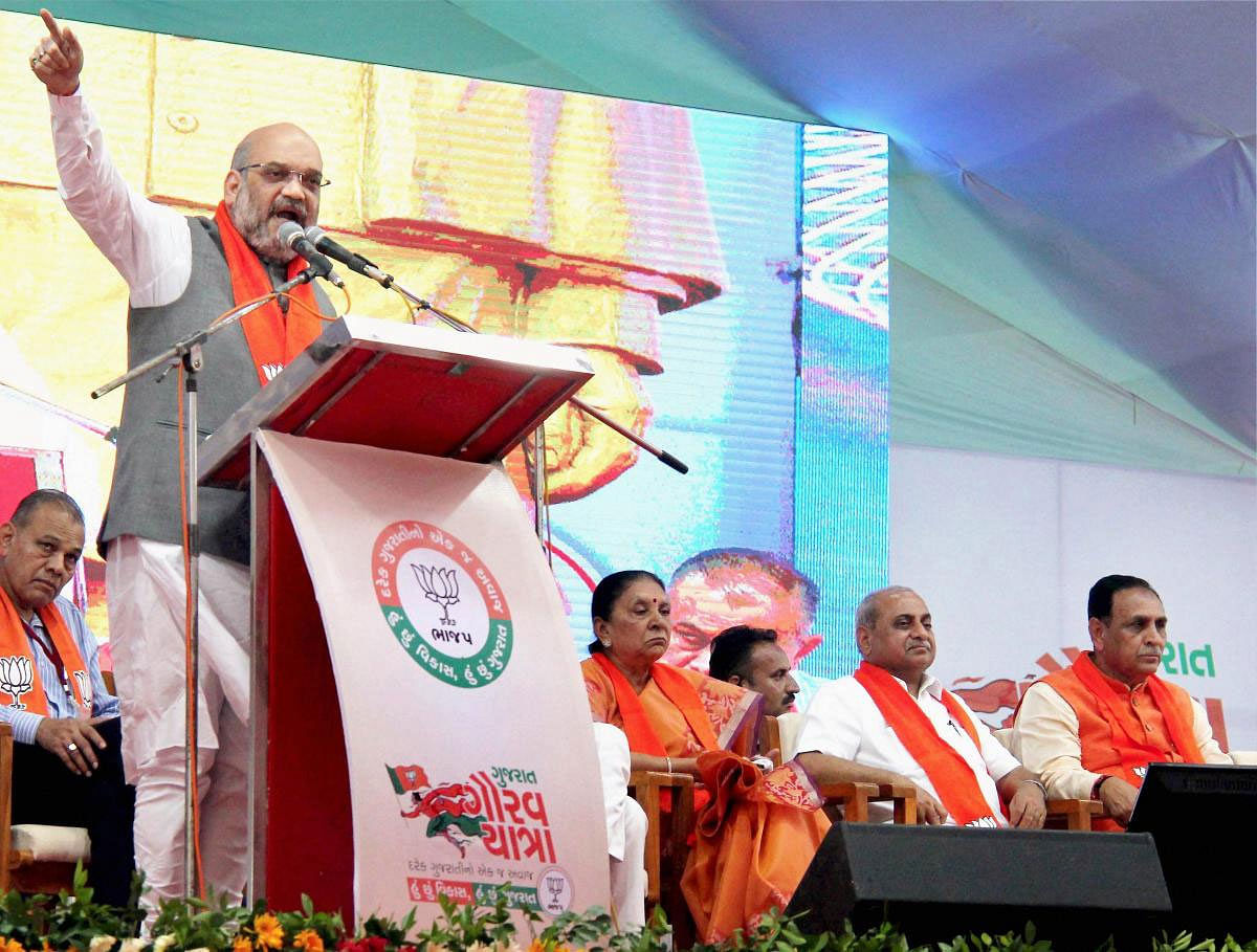 BJP President Amit Shah addresses a function to kick off the Gujarat Gaurav Yatra for the forthcoming Assembly polls, in Anand on Sunday. PTI Photo