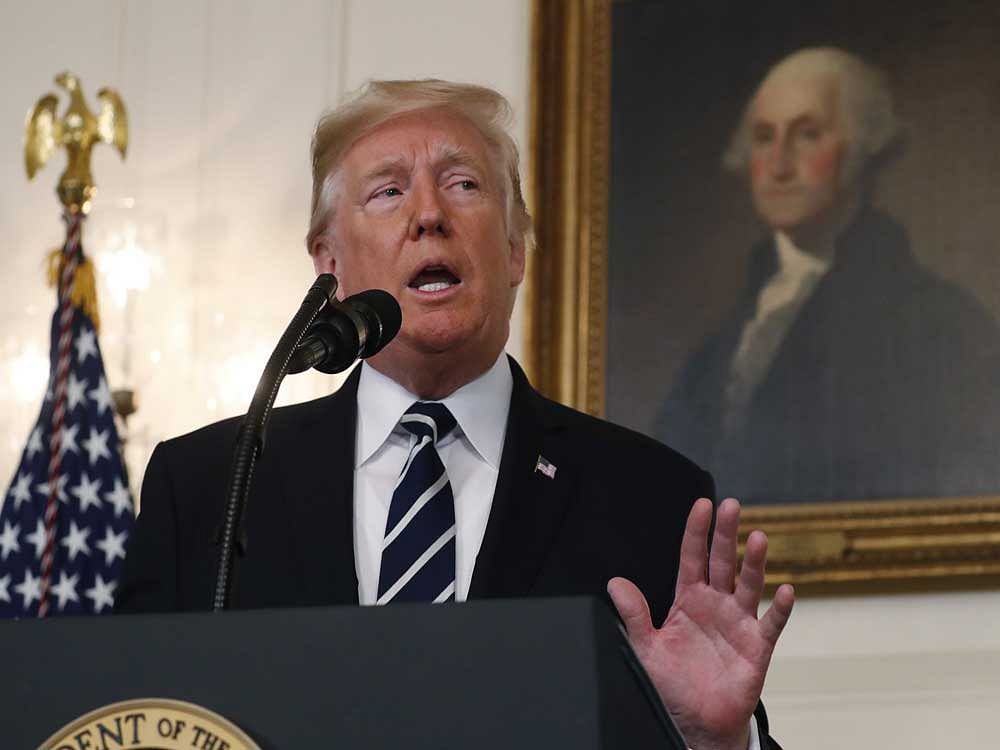 US President Donald Trump makes a statement on the mass shooting in Las Vegas in front of a portrait of President George Washington in the Diplomatic Room at the White House in Washington. Reuters