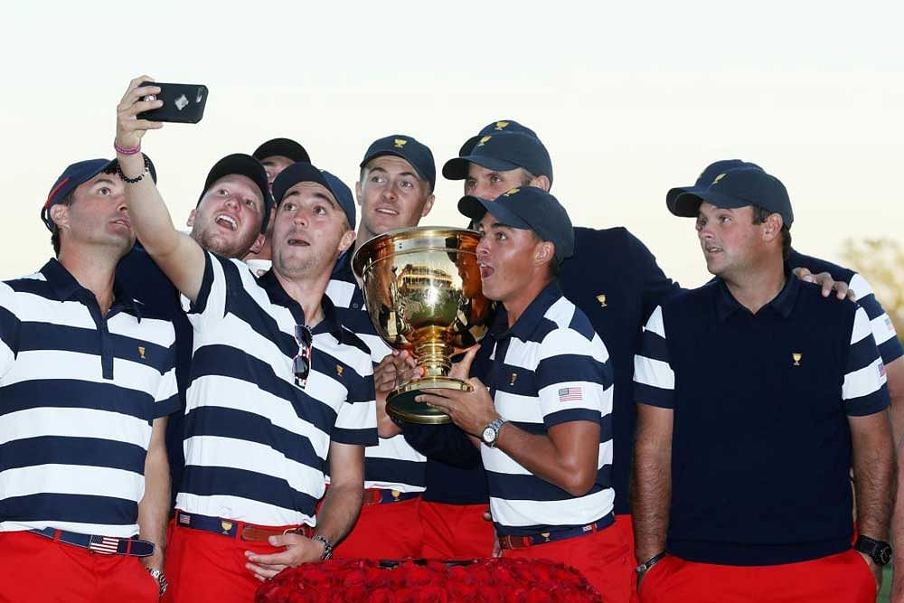 Smile Please: Team USA celebrate their win at the Liberty National Golf Club on Sunday. AFP